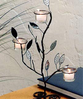 Our ivy scroll candelabra presents a very serene setting for any table top. These decorative ivy scroll ivy scroll candelabras will provide general lighting and create a dramatic focal point as a centerpiece in the dining room or just set atop any table. Try adding a bit of nature's beauty to your home with this unique candelabras. Glass votive holders are included  but votive candles are not. Holds 10 hour votives or tealights.