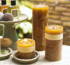 Our unscented Timber Candles come in warm soothing colors  burn beautifully and look as if they are straight out of nature with their rustic appearance. Bright colors make a great statement indoors or out. Comes uniquely wrapped with a palm leaf tied with a bamboo skin string. Timber Pillar Candles are unscented.