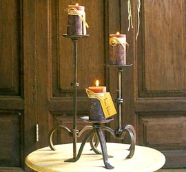 Looking for a unique  different way to display your tapers or candles. We've got just what you need. Mission Candleholders in rustic metal are perfect to hold our Timber Tapers or Timber Candles. View the large image to see how nicely our Timber Candles are diplayed on the Mission Candle Holders. Candles not included.