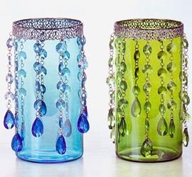 Want to put some fun into your candle holders  these jeweled dangle candle holders with do just that. These retro designed candle holders come in four different colors and fits any candle up to 3 1/2 inches in diameter. Sold individually.