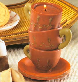 Asian Elements Stacking Tea Cups is lemon zinger tea scented. The tart and tangy scent of Lemon Zinger delivers a bolt of invigorating aroma to liven up your day. Includes the three stacking teacups and saucer. Fits perfect in the kitchen or with your asian motif.