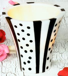 Experience a little Paris with you at home with this adorable scented Paris Nights Flared Lantern candle. Adorned with the cutest stripes and dots reminiscent of a parisian cafe  its sure to be a focal point of any room. Scented with French Parfum.